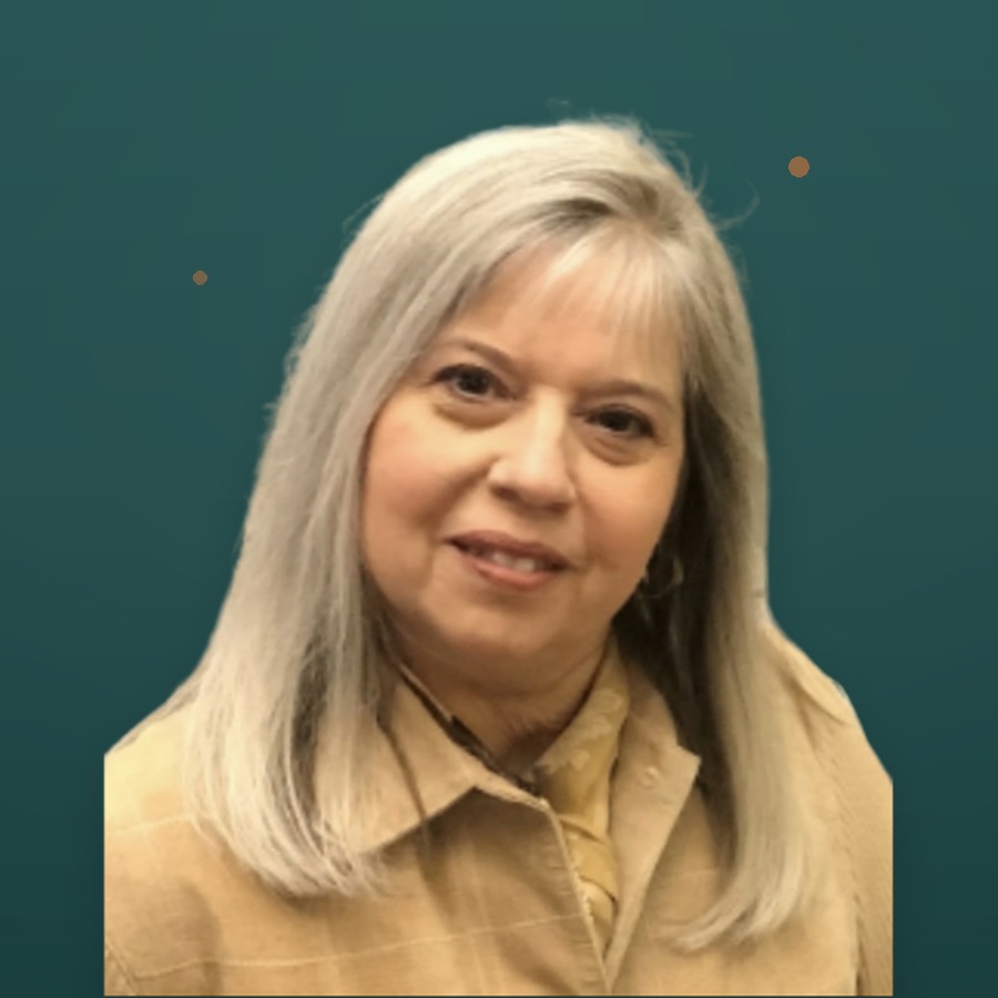 Kristin Milan, founder of Radiantly Alive Women, smiling warmly against a deep teal background